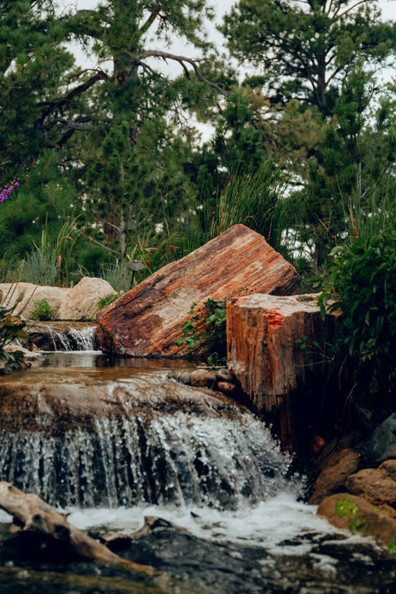 Landscaped waterfall feature built from stacked boulders